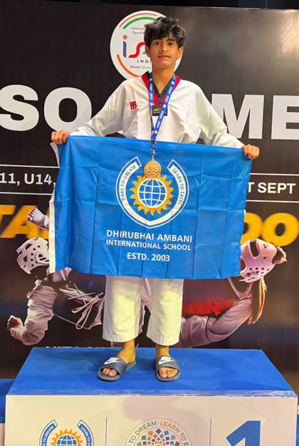 Ilaan Kapadia of Class 9A holding his Gold medal at the ISSO National Taekwondo Tournament