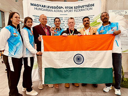 Indian aerial sports team (Vir Gahrotra) with coaches holding the Indian flag in Hungary