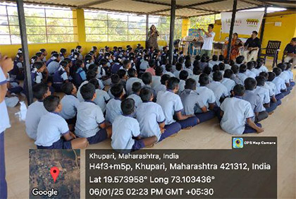 Ishaan Surve addressing students during a visit to Khupari village
