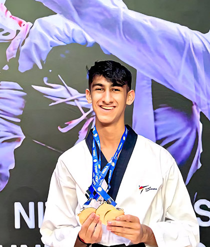Jayveer Kochhar of Year 12 celebrating his triple Gold win at the ISSO National Taekwondo Tournament