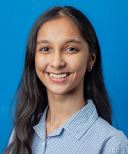 Khushi Bihani receiving an award for her global achievement