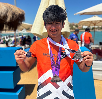 Krishiv Gupta with his medal at Oceanman Egypt