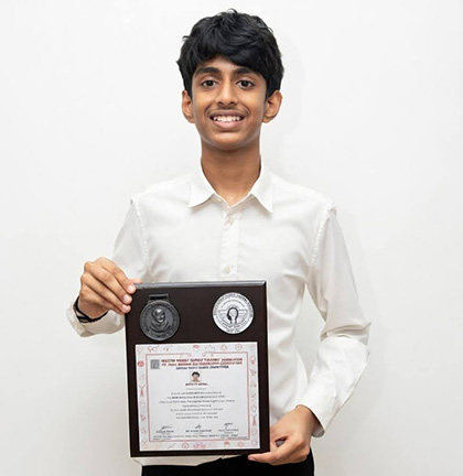 Siddharth Nayak holding merit certificate for Homi Bhabha Balvaidnyanik Science Competition