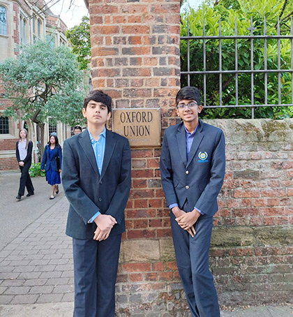 Saketaram Manikantan and Samar Sinha posing at the Oxford Union during the ICYD Finals 2026