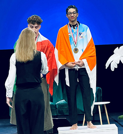 Vir Gahrotra Indian aerial sports athlete on the podium with a gold medal