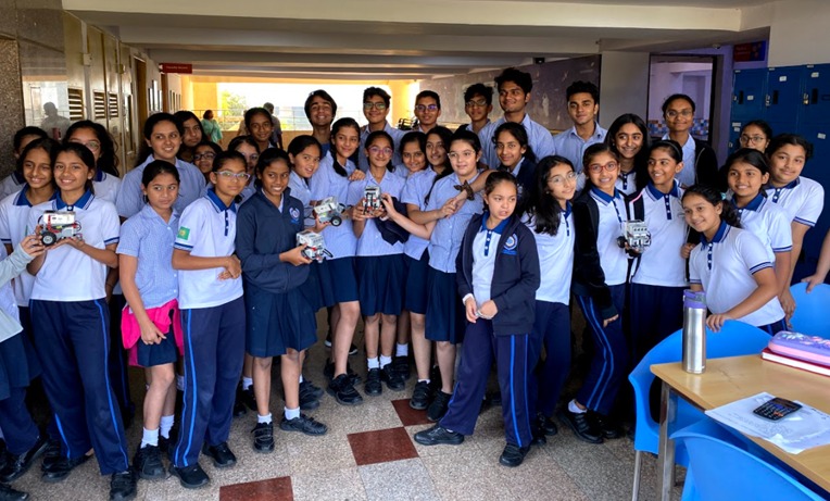 Team Elev8 outreach — students with robots